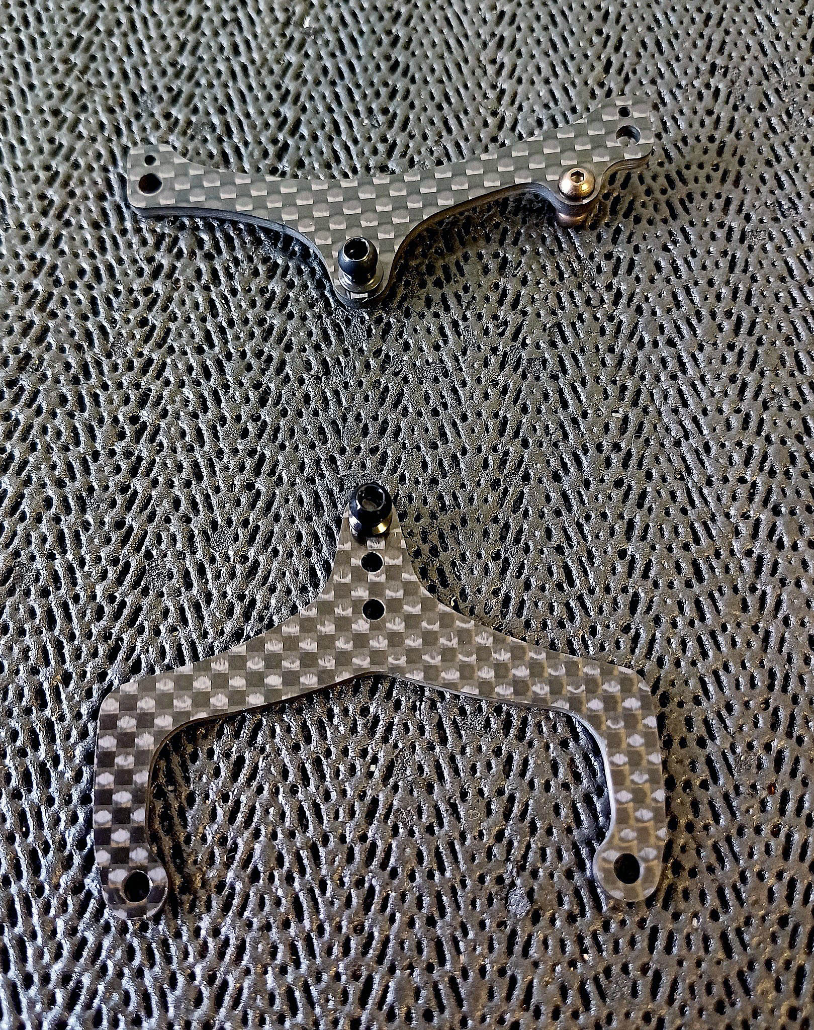 A pair of carbon fiber parts