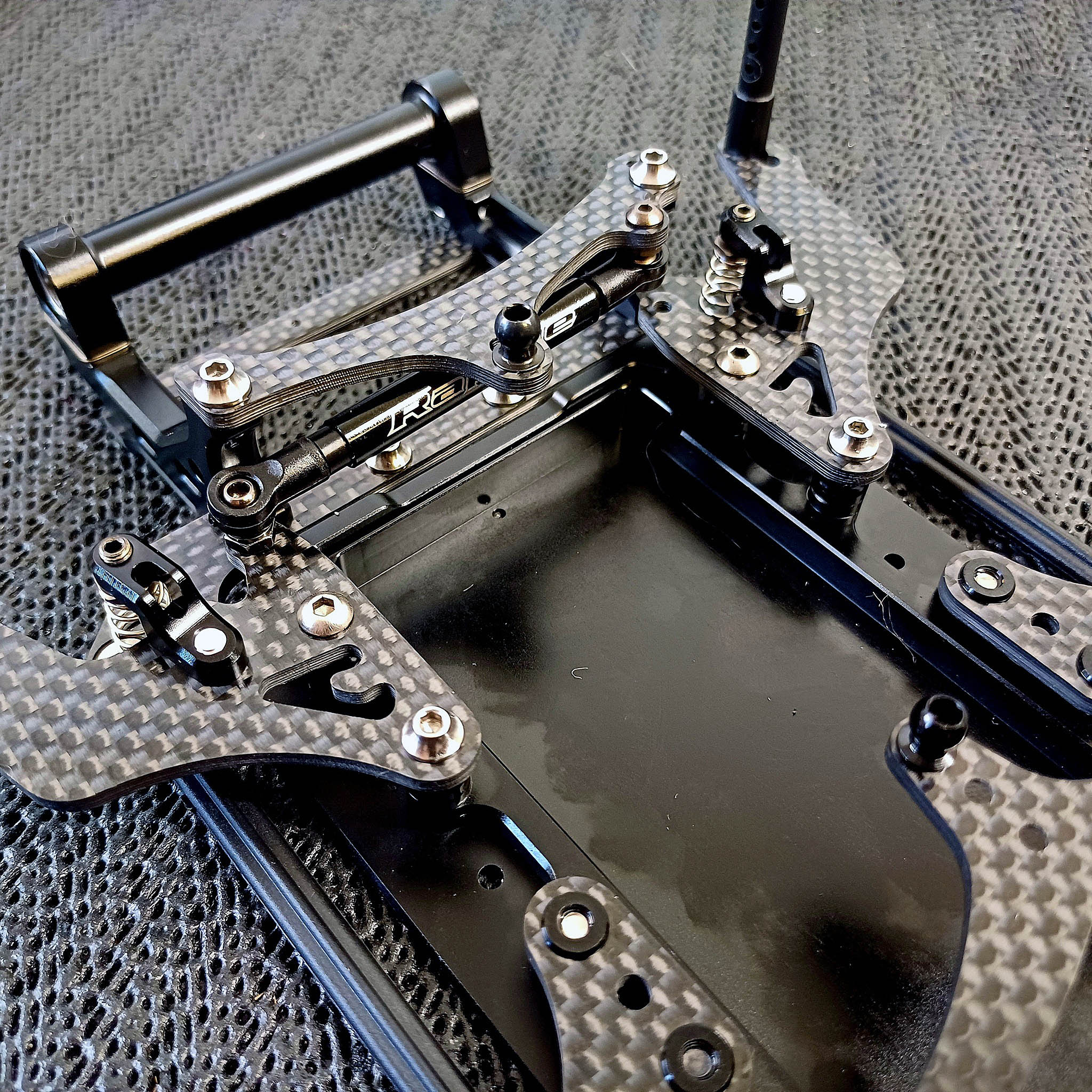 A black and grey carbon fiber frame